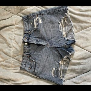 High rise jean shorts with rips in them